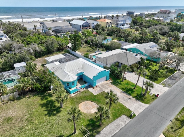 birds eye view of property with a residential view and a water view