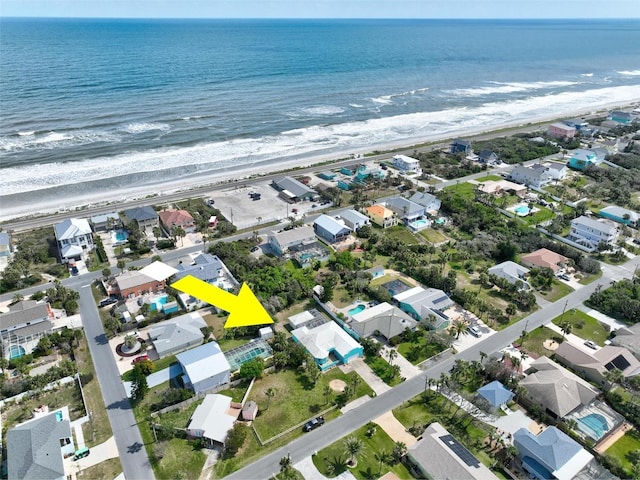 bird's eye view featuring a water view and a residential view