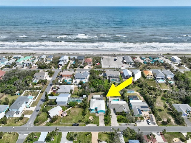 bird's eye view featuring a water view and a residential view