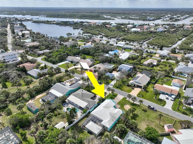 birds eye view of property with a residential view and a water view
