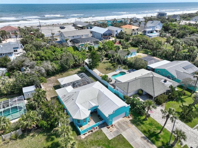 drone / aerial view featuring a residential view and a water view