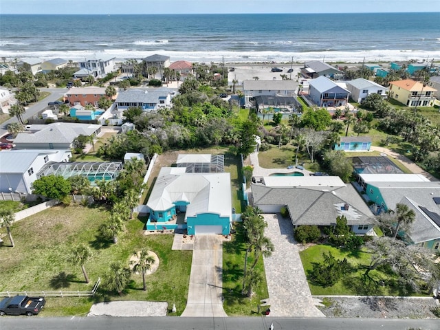 drone / aerial view featuring a residential view and a water view
