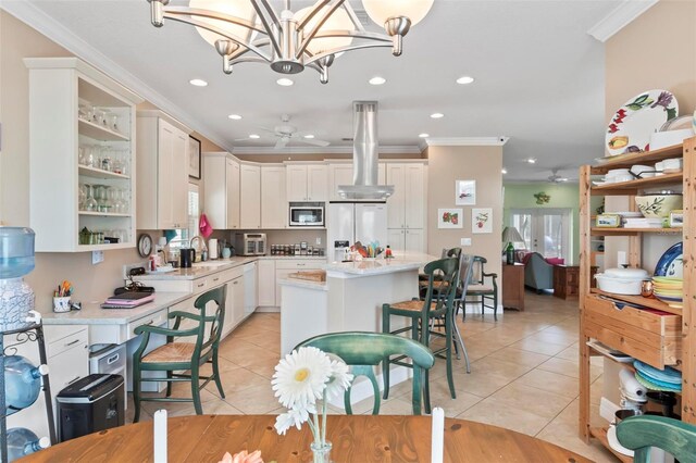kitchen with light tile patterned floors, stainless steel microwave, fridge with ice dispenser, and a sink