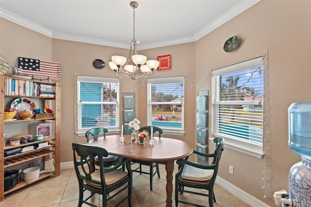 dining space with baseboards, an inviting chandelier, and crown molding