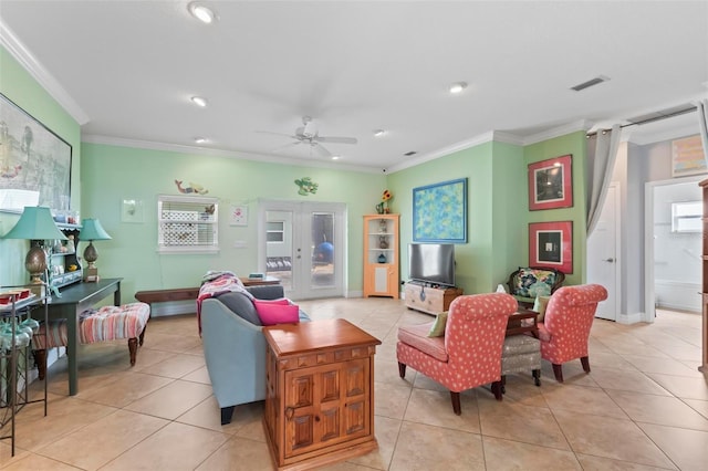 living room featuring light tile patterned floors, visible vents, ceiling fan, and crown molding