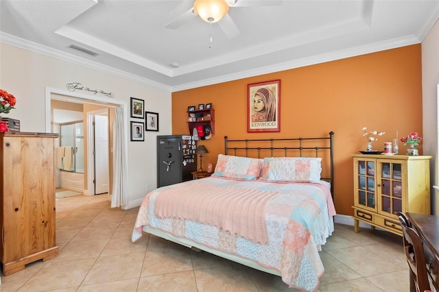 bedroom featuring light tile patterned floors, visible vents, a raised ceiling, and baseboards