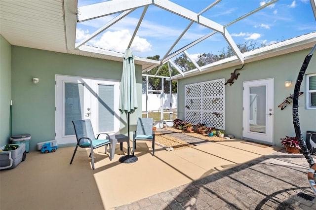 view of patio / terrace featuring a lanai
