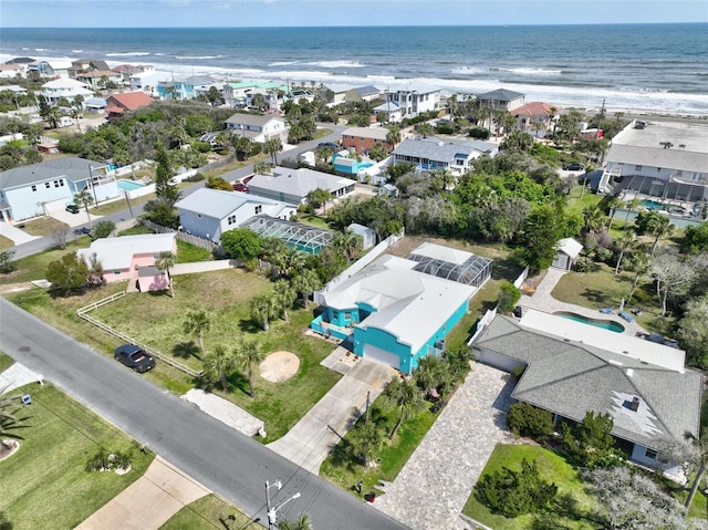 bird's eye view featuring a residential view and a water view