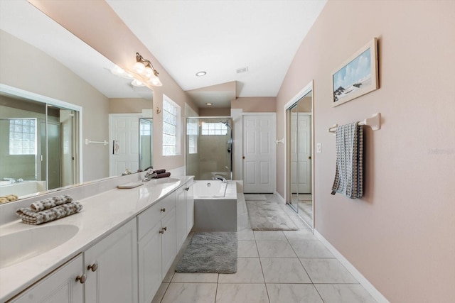 bathroom with lofted ceiling, a sink, a bath, double vanity, and a stall shower