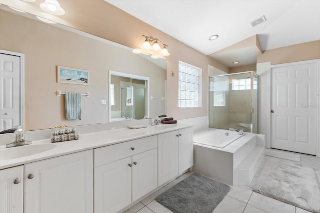 full bathroom featuring double vanity, a stall shower, visible vents, and a sink