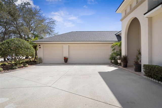 garage featuring driveway