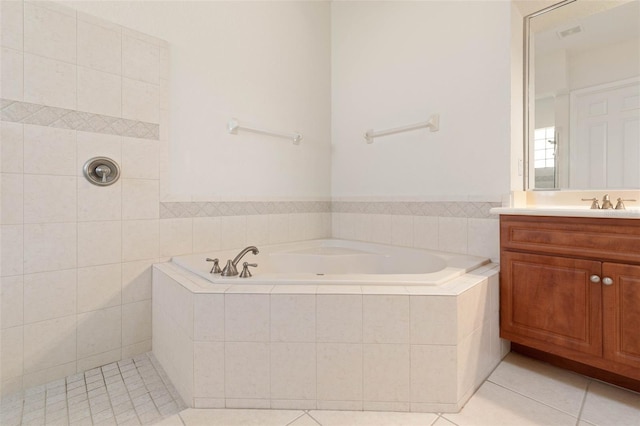 full bathroom with visible vents, a garden tub, vanity, and tile patterned flooring