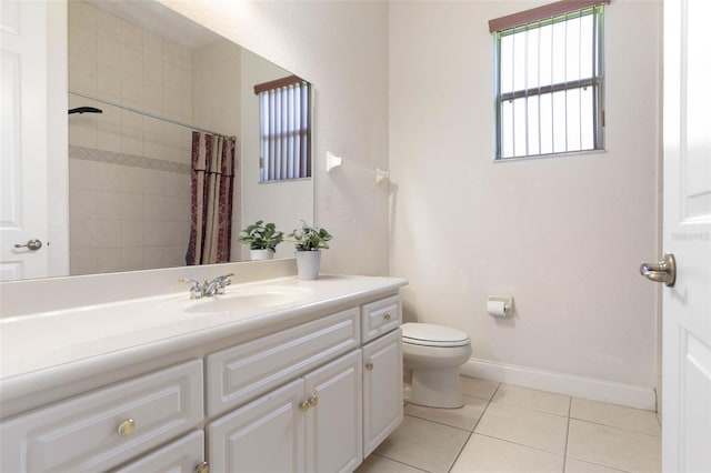 full bath featuring toilet, curtained shower, tile patterned flooring, baseboards, and vanity