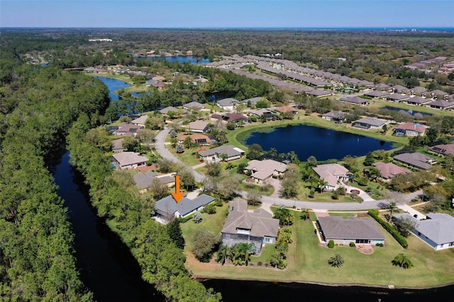 bird's eye view with a residential view and a water view