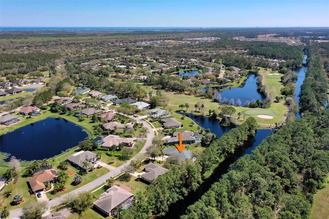 birds eye view of property featuring a water view and a residential view