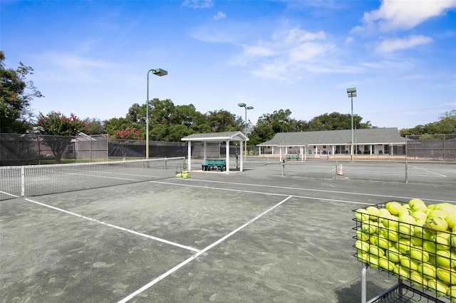 view of sport court with fence