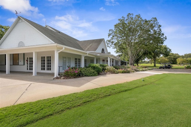 view of home's exterior with a lawn