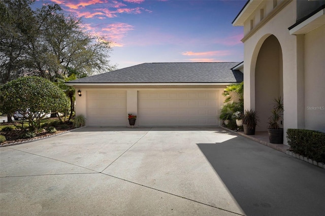 garage featuring driveway