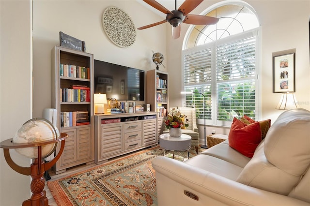 living area with ceiling fan