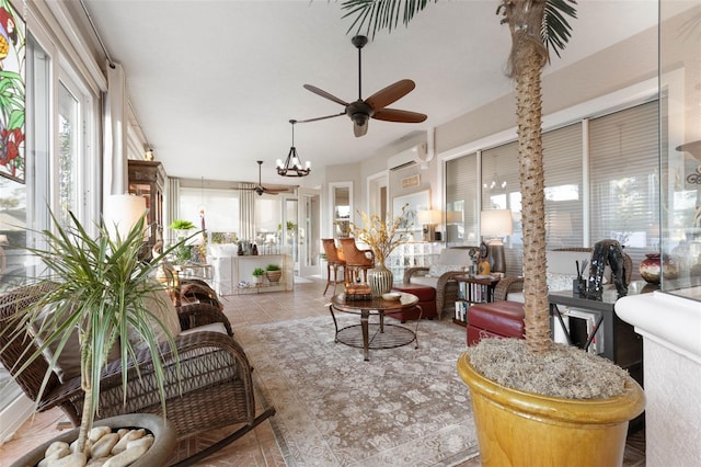 sunroom / solarium with ceiling fan and a wall mounted AC