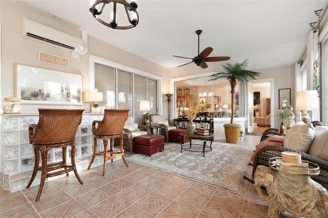 living room featuring ceiling fan, an AC wall unit, and plenty of natural light