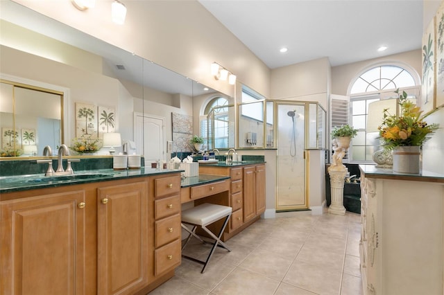 bathroom with a stall shower, tile patterned flooring, visible vents, and a healthy amount of sunlight