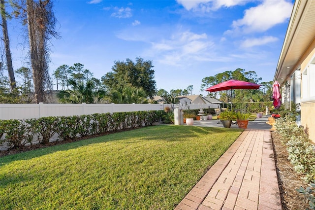 view of yard featuring a patio area and fence