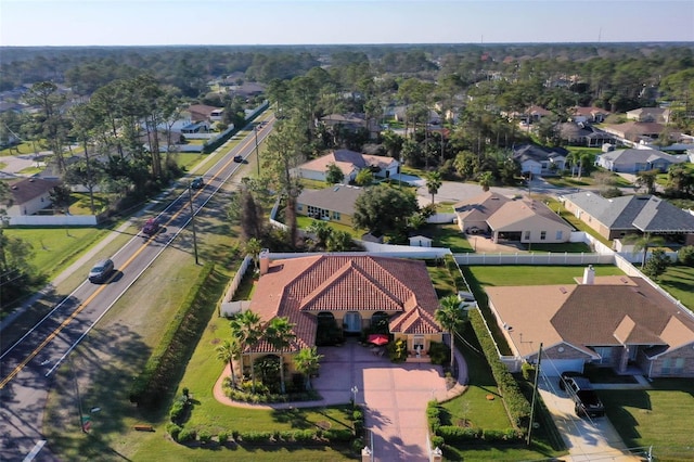 birds eye view of property with a residential view