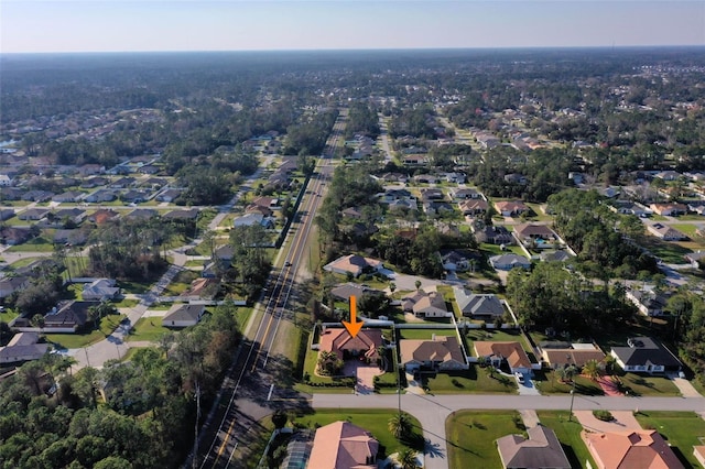 birds eye view of property with a residential view