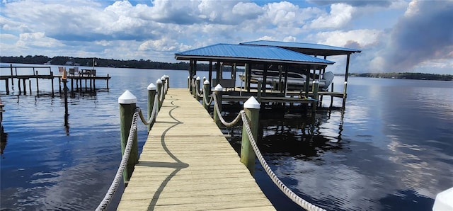 view of dock featuring a water view and boat lift