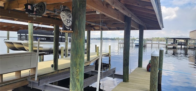 view of dock featuring a water view and boat lift