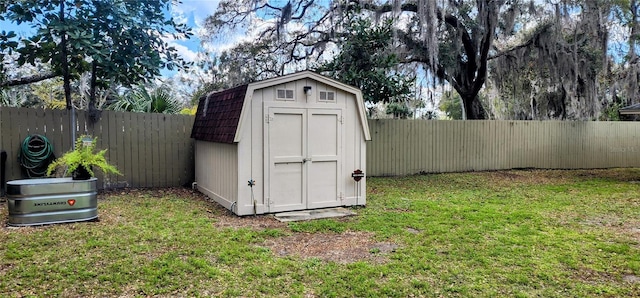 view of shed with a fenced backyard