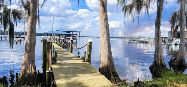 view of dock featuring a water view and boat lift