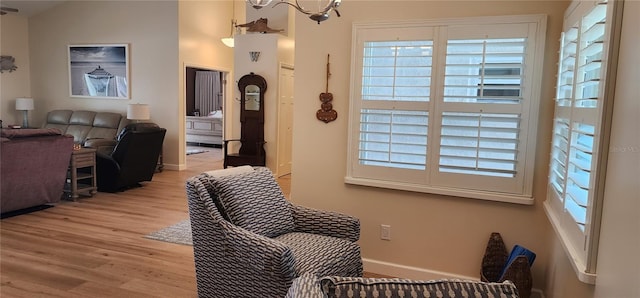 interior space with wood finished floors and baseboards