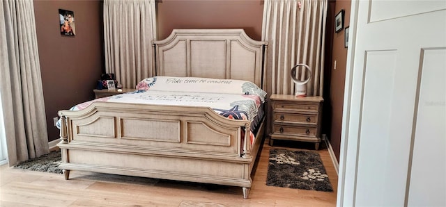 bedroom featuring wood finished floors