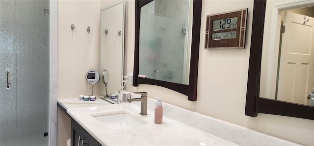 bathroom featuring a stall shower and vanity