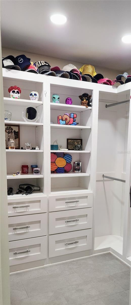 walk in closet featuring tile patterned flooring