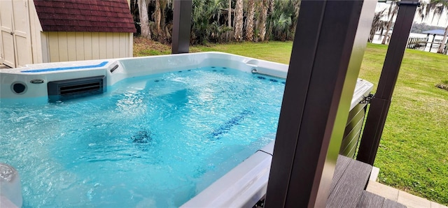 view of pool featuring a hot tub and a yard