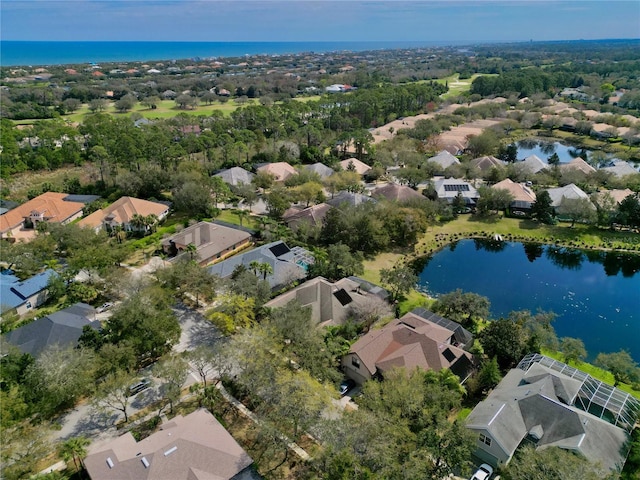 bird's eye view featuring a residential view and a water view