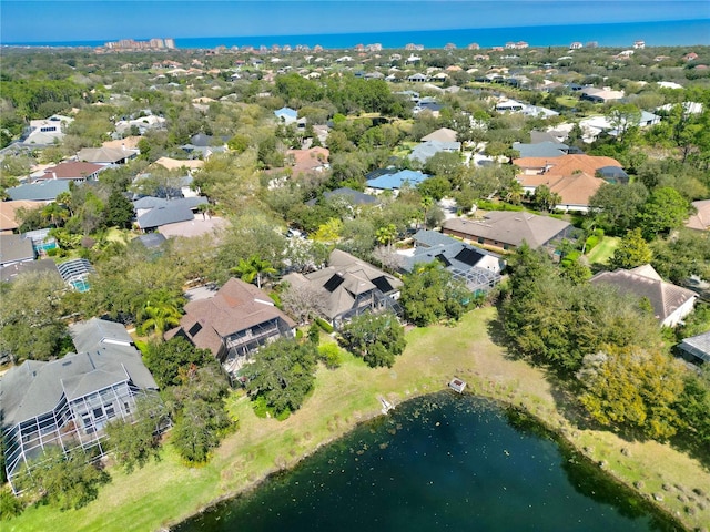 birds eye view of property featuring a water view and a residential view