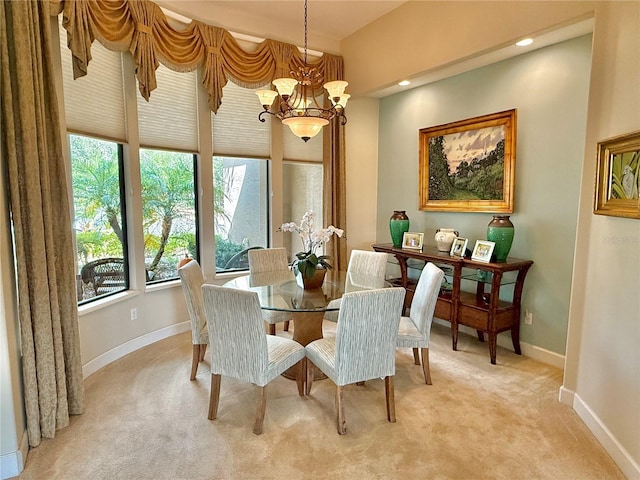 dining space with light carpet, baseboards, a notable chandelier, and recessed lighting