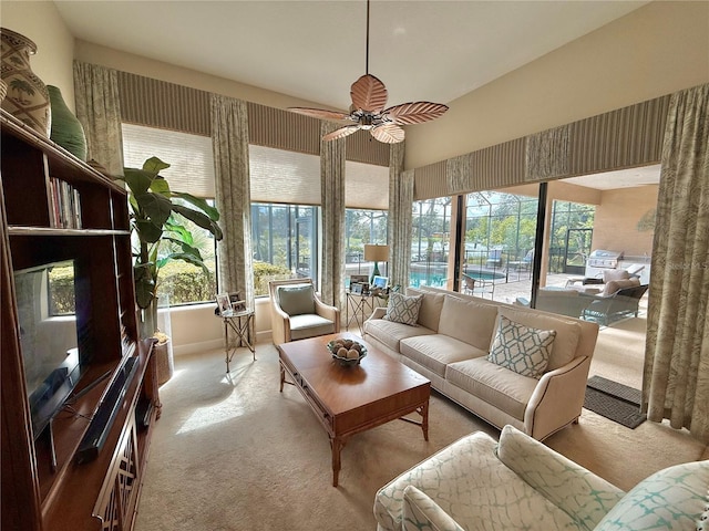 sunroom featuring a ceiling fan and plenty of natural light