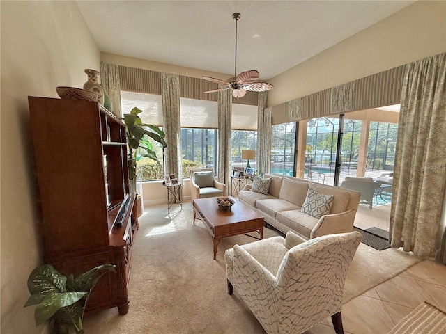 sunroom / solarium with a ceiling fan and a wealth of natural light