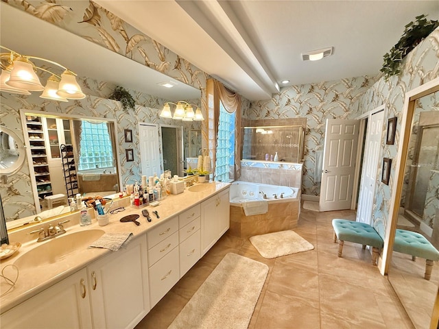 bathroom featuring wallpapered walls, visible vents, a garden tub, and a sink