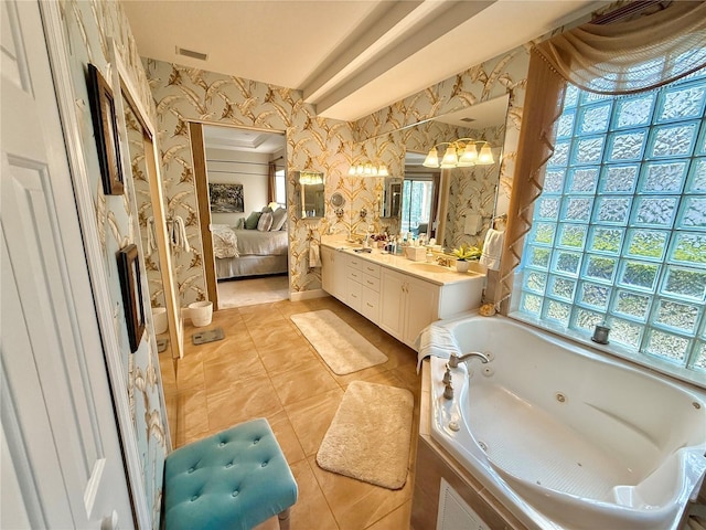 bathroom with connected bathroom, a sink, visible vents, a jetted tub, and wallpapered walls