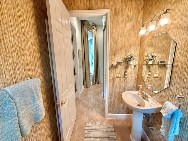 bathroom with tile patterned flooring and baseboards