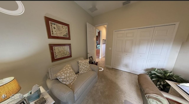 carpeted living room featuring visible vents and vaulted ceiling