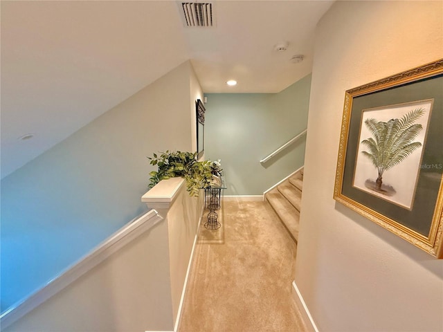 hall featuring carpet floors, recessed lighting, visible vents, stairway, and baseboards