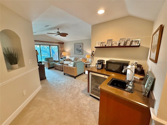 office space featuring light carpet, beverage cooler, visible vents, baseboards, and vaulted ceiling