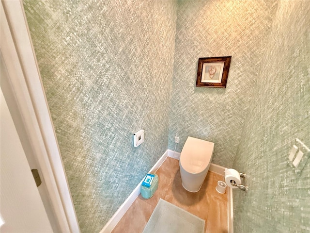 bathroom with toilet and tile patterned flooring